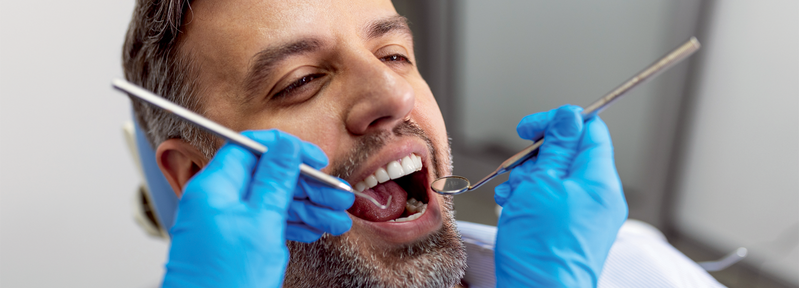 man-at-the-dentist-1600x578.png