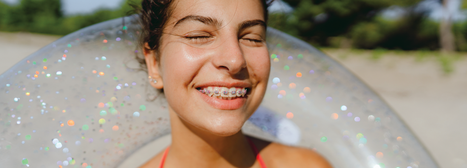 girl-with-braces-smiling-1600x578.png
