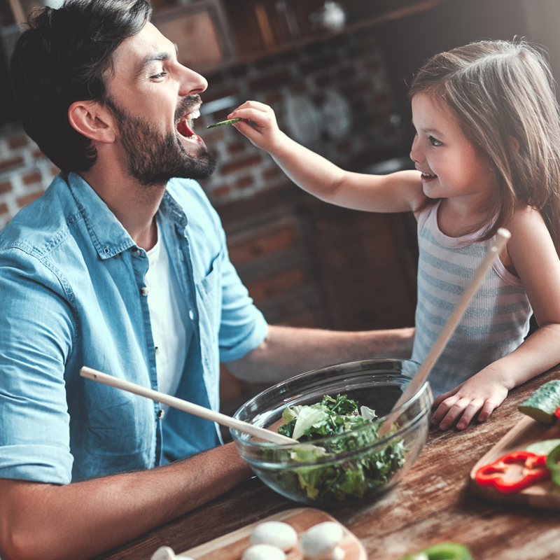 father-and-daughter-eating-salad-800x800.png