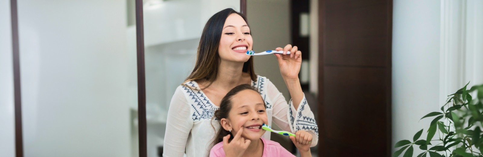 ESP-family-with-toothbrushes-1600x522.jpeg